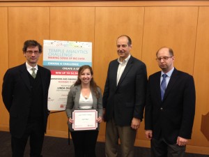 Fox School Management Information Systems professors James Moustafellos, far left, and David Schuff, far right, recognize Tyler School of Art student Cassandra Reffner as the winner of the 2014 Temple Analytics Challenge. Third from left is Doug Seiwert, Vice President of Information Technology at QVC, who served as the event’s keynote speaker.
