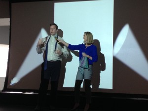 Fox School students Eric Hamilton and Brooke Lehman offer tips on how to properly pull off accessories, like tying a neck tie and wearing a decorative scarf, during CSPD’s Work Your Wardrobe event.