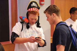 Photo of two students talking at the 2015 SPO fair