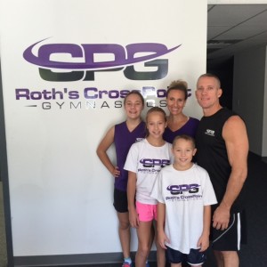 Fox School of Business alumnus Bill Roth and his wife Christina, with their children, at Crosspoint Gymnastics in Glen Mills, Pa.