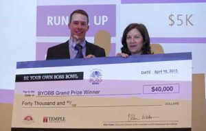 Ellen Weber, right, Executive Director of Temple’s Innovation and Entrepreneurship Institute, awards Ben Stucker, MBA ‘13, the grand prize of the 2015 Be Your Own Boss Bowl.