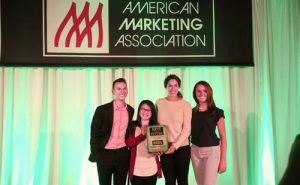 Fox Marketing students Alexander Brannan, Lily Tran, Abbey Harris, and Rachel Baker hold their first-place plaque after winning the American Marketing Association’s Collegiate Case Competition.