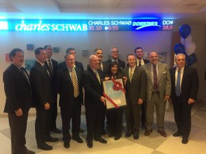 Assistant Professor of Finance, Cindy Axelrod joined by members of the Charles Schwab Foundation in receiving the Financial Planning Center.