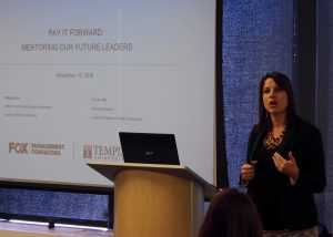 Professor Becca Zinn guides mentorship participants through a presentation on cultivating leadership opportunities within organizations