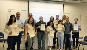 Group of students with certificates of completionMembers of the consulting team with their certificates of completion.