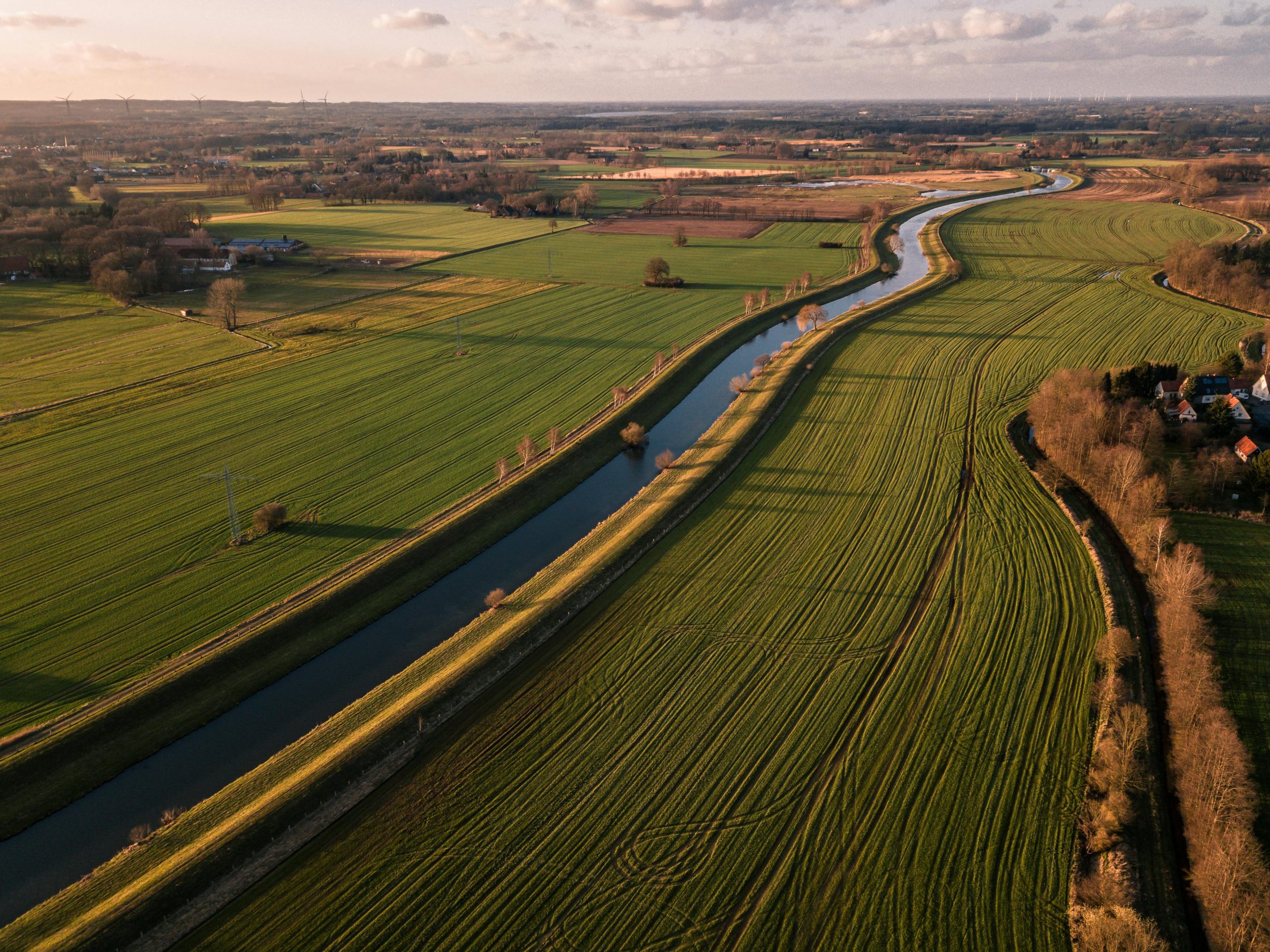 Large farming fields divided by a river.