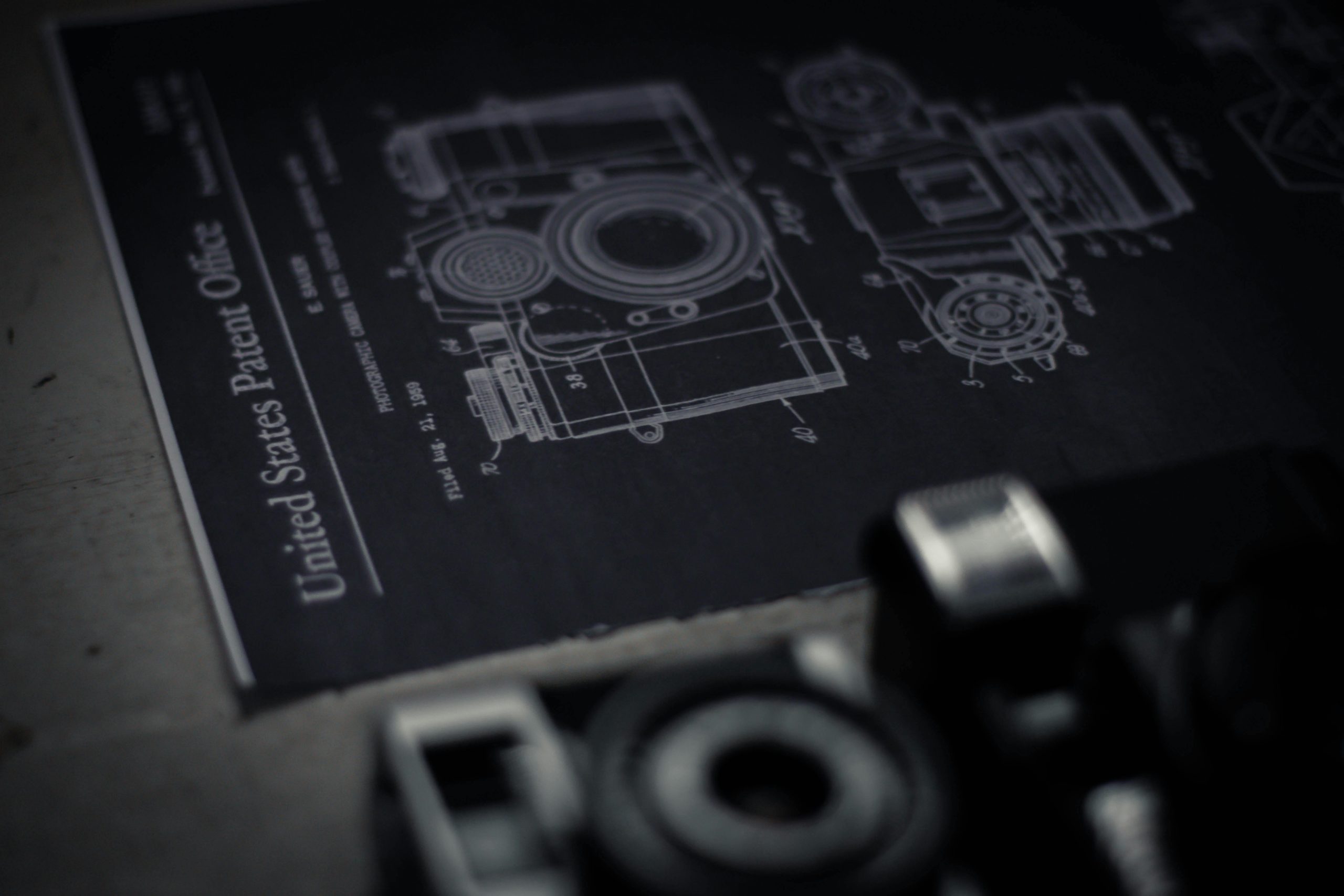 A close view of a camera and its blueprints