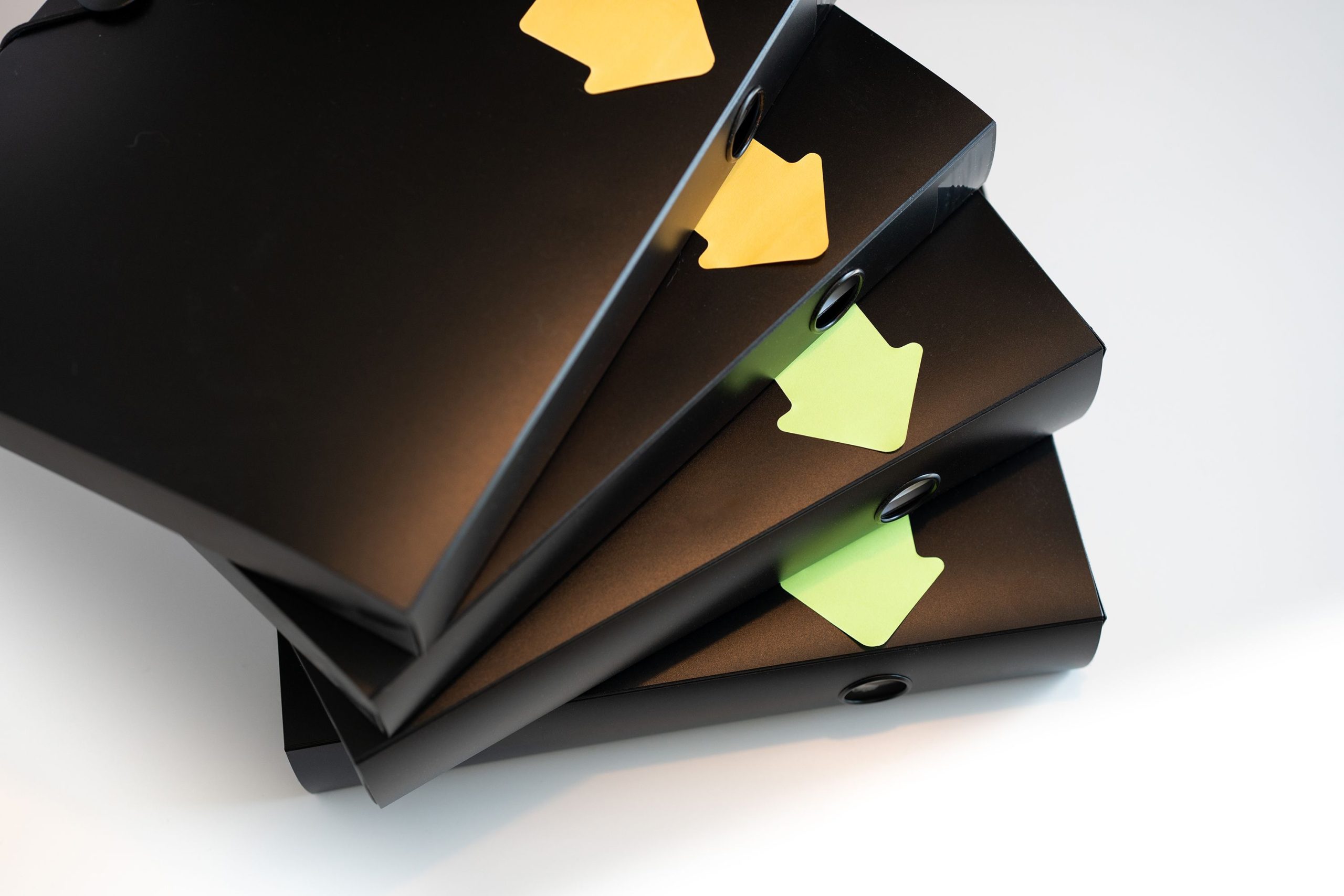 Black folders with arrow shaped markings. Decoration photo.